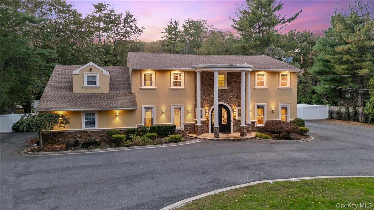 Welcome to this exquisite gated estate, a meticulously updated 5, 000-square-foot center hall Colonial masterpiece that exudes timeless elegance and sophistication. Step inside to discover gleaming hardwood floors that flow seamlessly throughout, infusing the space with a warm, inviting ambiance.The expansive layout boasts a grand formal living room bathed in natural light, an opulent formal dining room ideal for lavish gatherings, a state-of-the-art eat-in kitchen with premium finishes, and a cozy den anchored by a majestic fireplace. Enhancing the main level&rsquo;s allure is a versatile bonus living room and a luxurious guest bedroom suite, offering unparalleled convenience and privacy.Ascend to the sumptuous primary suite, where a crackling fireplace and private balcony provide breathtaking views of the sprawling backyard oasis. This serene retreat features a shimmering inground pool, meticulously laid pavers, and an expansive deckâ€”perfect for sophisticated entertaining or tranquil relaxation under the stars.This exceptional property masterfully harmonizes the finest in indoor luxury with idyllic outdoor living. Descend to the fully finished basement, a versatile haven for a bespoke home office or indulgent recreational space. Complete with a tennis court (offered as is) and served by the prestigious Half Hollow Hills school district, this residence is a rare gem for the discerning buyer.