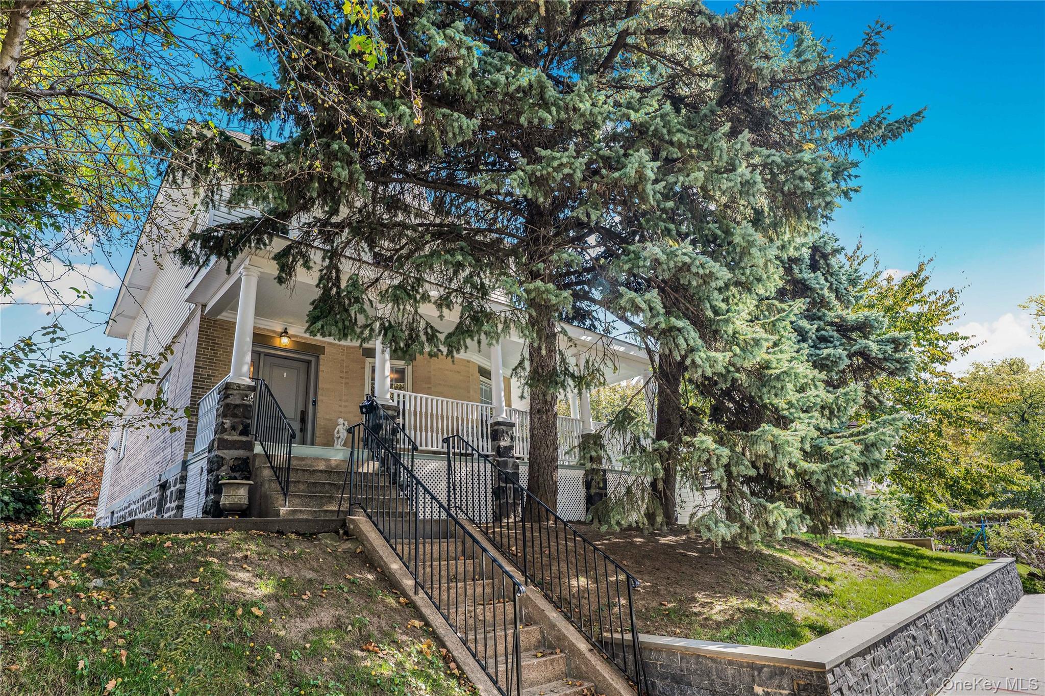 Unique Opportunity! Magnificent Victorian House on Lush Landscaped Grounds.Welcome to this stunning 4 bedroom/4.5 bath home in North Flushing. Stretching from Murray Lane to Murray Street, the house sits on a lush, oversized property and has two convenient entrances. The entire house, on four levels, has been remodeled with high end finishes and detail. All aspects of the house were meticulously renovated. There is an island kitchen, marble bathrooms, a master bedroom suite and a third level suite. The lower level has a separate entrance, with large family room, office, kitchen, full bath and laundry room. The flooring is wood, granite and marble with radiant heating. Also featured are designer light fixtures, tons of closets and storage and a smart alarm system. This gorgeous house sits on a spectacular property. Relax on the wrap around porch with sound system, which leads to a landscaped side yard and backyard. The patio in the backyard is perfect for outdoor dining and entertaining. A two car garage sits on the corner of the property, facing Murray Street. Park with ease and walk right into your house from the backyard entrance. Make this beautiful house yours and have a life of comfort and convenience.