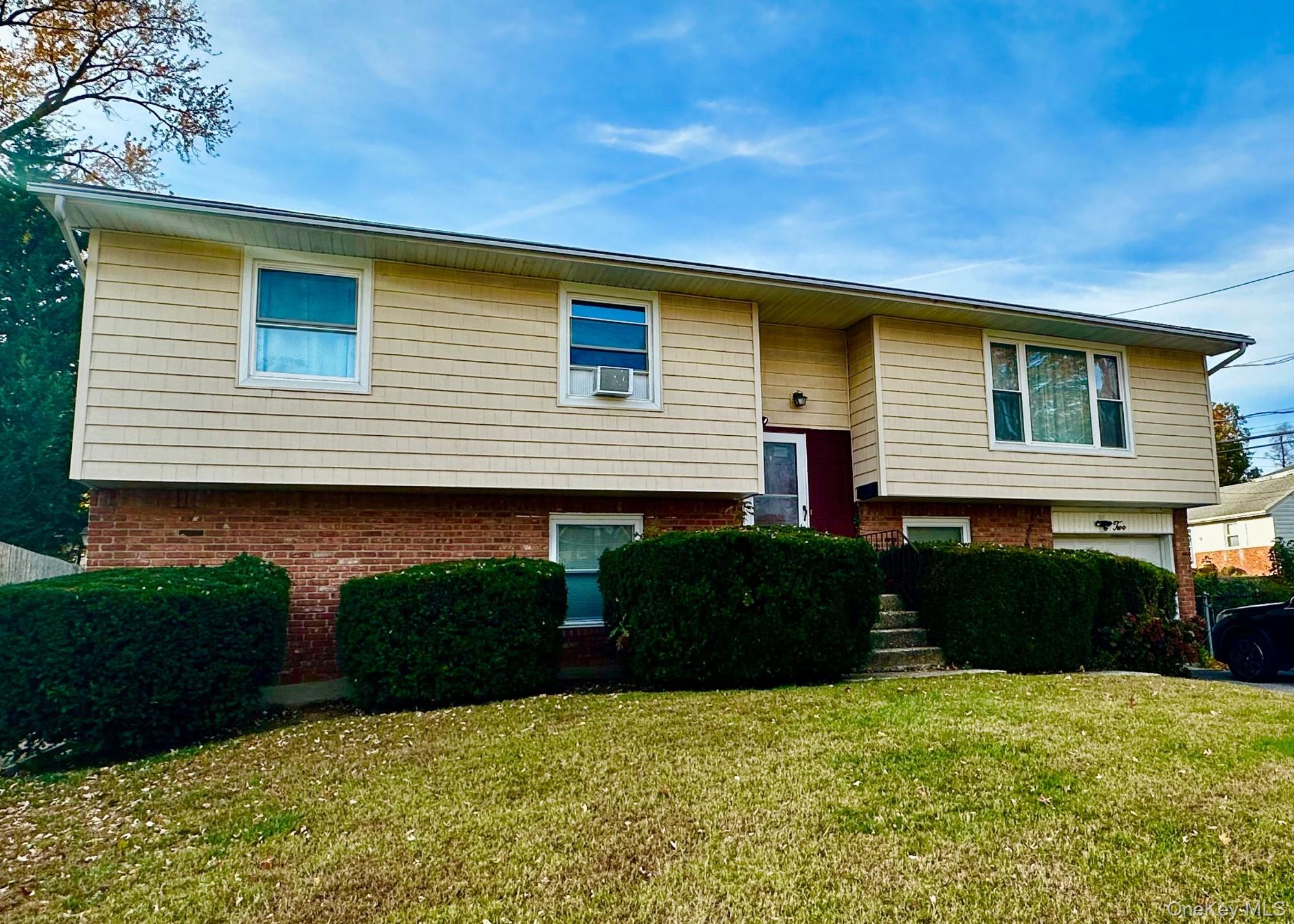 Beautiful ground-level 2-bedroom, 1-bath apartment with a private entrance on a quiet residential street. This bright and spacious rental features a large, comfortable living room and an eat-in kitchen with gas cooking and built-in microwave. Additional highlights include central air, an in-unit washer and dryer, and an outdoor patio area. Conveniently located near shopping, restaurants, schools, libraries, and public transportation.