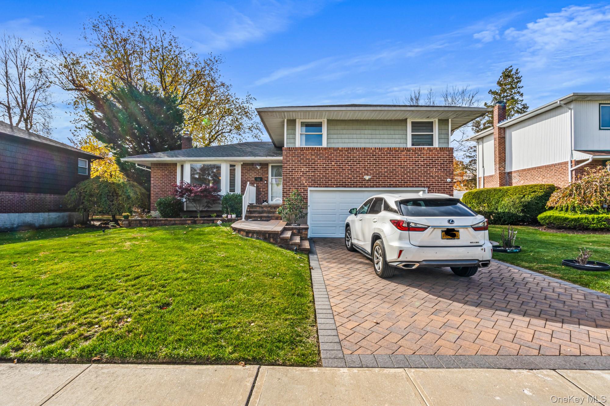 Welcome to this beautifully renovated Split-Style home in the heart of Plainview. This stunning residence offers 3 spacious bedrooms, 2.5 baths, and a full finished basement-prefect for relaxation or entertaining. Completely updated in 2018 , the home blends modern design with timeless comfort. Enjoy sun-filled living spaces, a stylish kitchen, and a meticulously maintained interior throughout. Nestled in a quiet, desirable neighborhood within a top-rated school district, this home offers both elegance and convenience-close to shopping, parks, and all local amenities. Move right in and experience the best of Plainview Living!