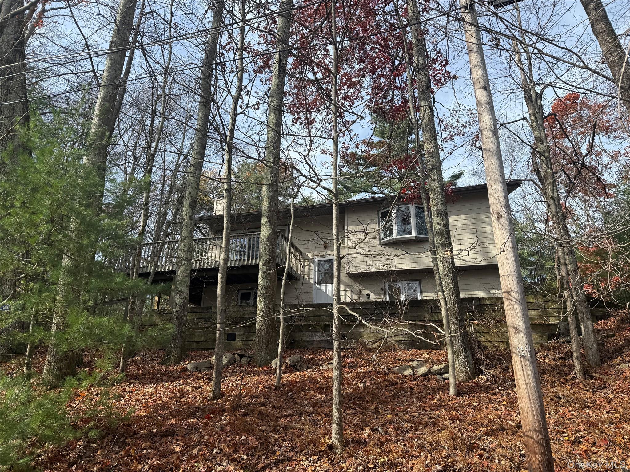 Retro Lakefront Charm with Stunning Views â€“ A Hidden Gem Just Two Hours from NYC. Step back into the classic charm of the 1960s with this inviting 3-bedroom, 2-bath lakefront home nestled in a beloved community where generations of families have made lasting memories. Located on a pristine glacier lake, this home offers year-round beauty and recreationâ€”from kayaking and sailing to fishing and peaceful meditation. Inside, enjoy the warmth of hardwood floors, a cozy woodstove in the family room, and a spacious layout perfect for gathering. The large back deck is ideal for morning coffee or summer dinners, while the private 1-car garage adds extra convenience. Wake up to breathtaking sunrises and spend your evenings on a members-only sandy beach watching unforgettable sunsets. All this just minutes from the Delaware River, amazing restaurants, antique shops, farmers markets, Bethel Woods Performing Arts Center, and the Kadampa Meditation Center. Donâ€™t miss this rare opportunityâ€”call today for your private tour. Paradise is closer than you think.