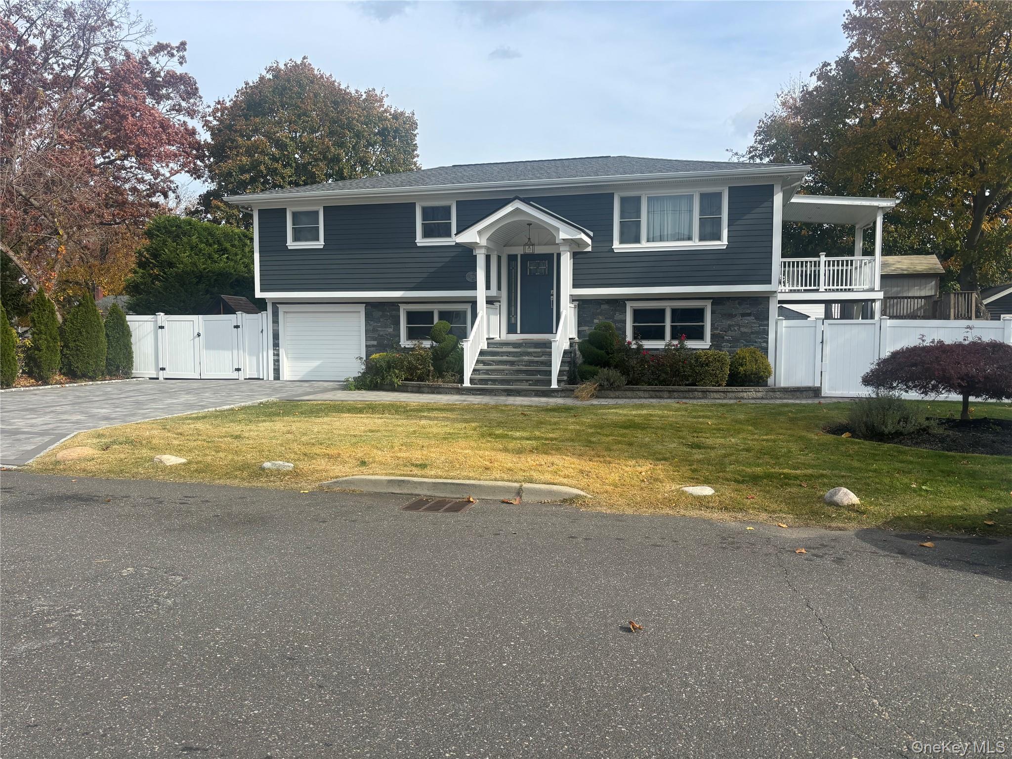 Welcome to this big hi-ranch that offers 4 generous bedrooms and 2 full bathrooms, perfect for extended families or those seeking extra space.Nestled on a sunny large property, this home boasts excellent curb appeal and a large driveway with ample parking for multiple vehicles. The layout features a bright upper level with living and dining area, a well-appointed kitchen, and three bedrooms. The lower level includes additional bedrooms, a full bath, and flexible space ideal for guests, a home office, or recreation. Call today to schedule an appoitment. Minute to train station , stores , etcs.