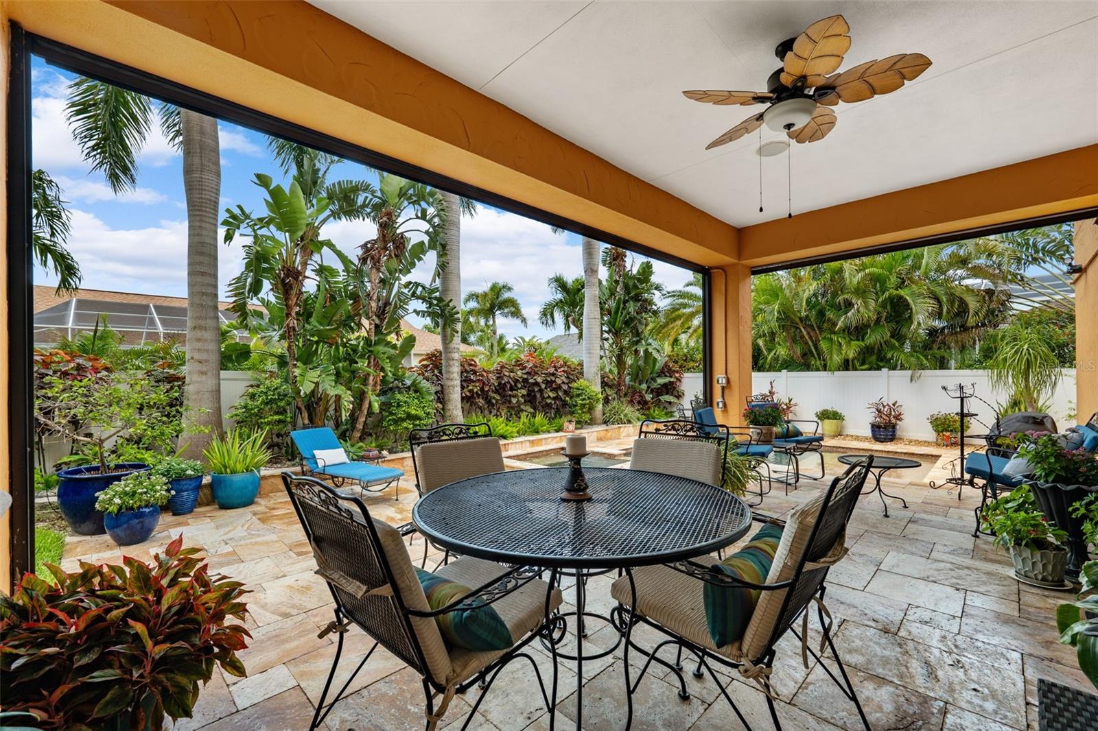 Covered patio with retractable screens!