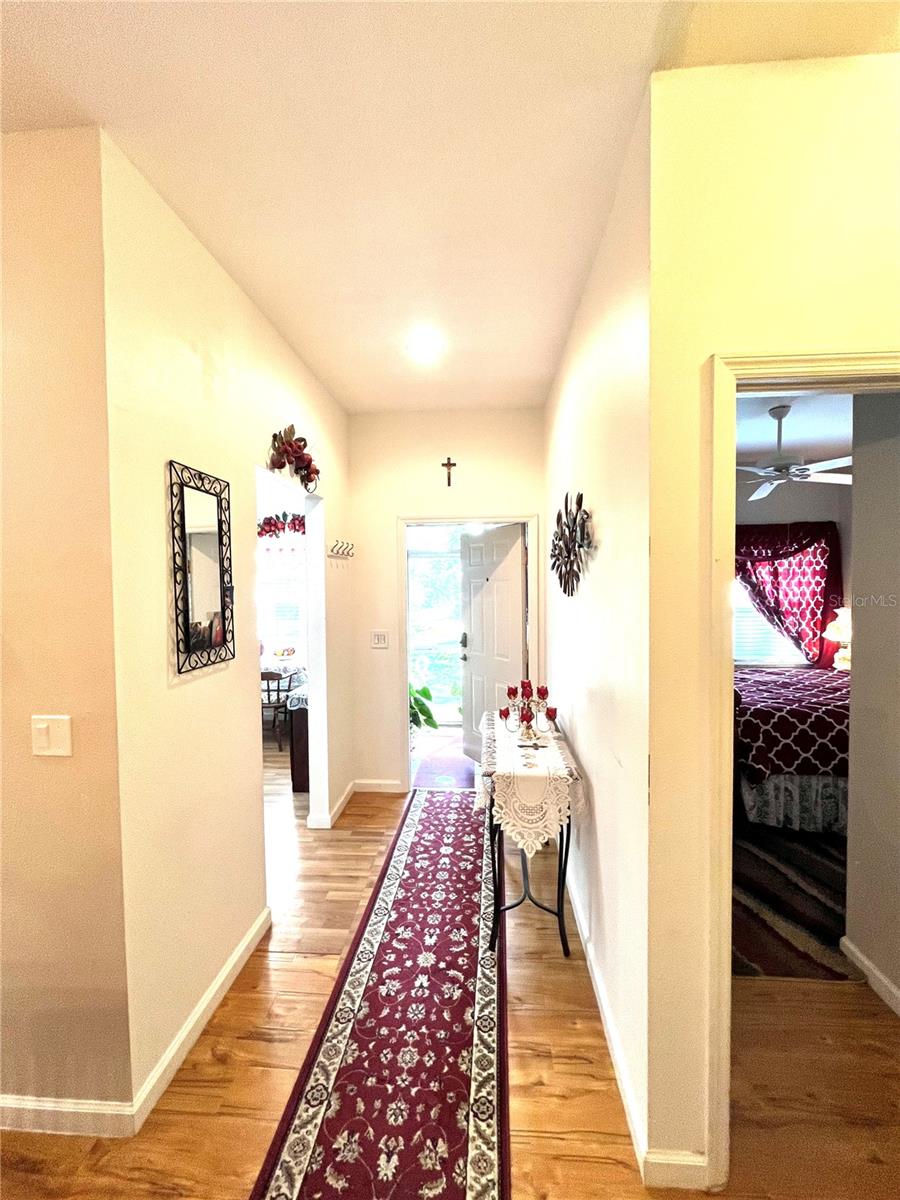 Front door with kitchen to left and bedroom 2 on the right