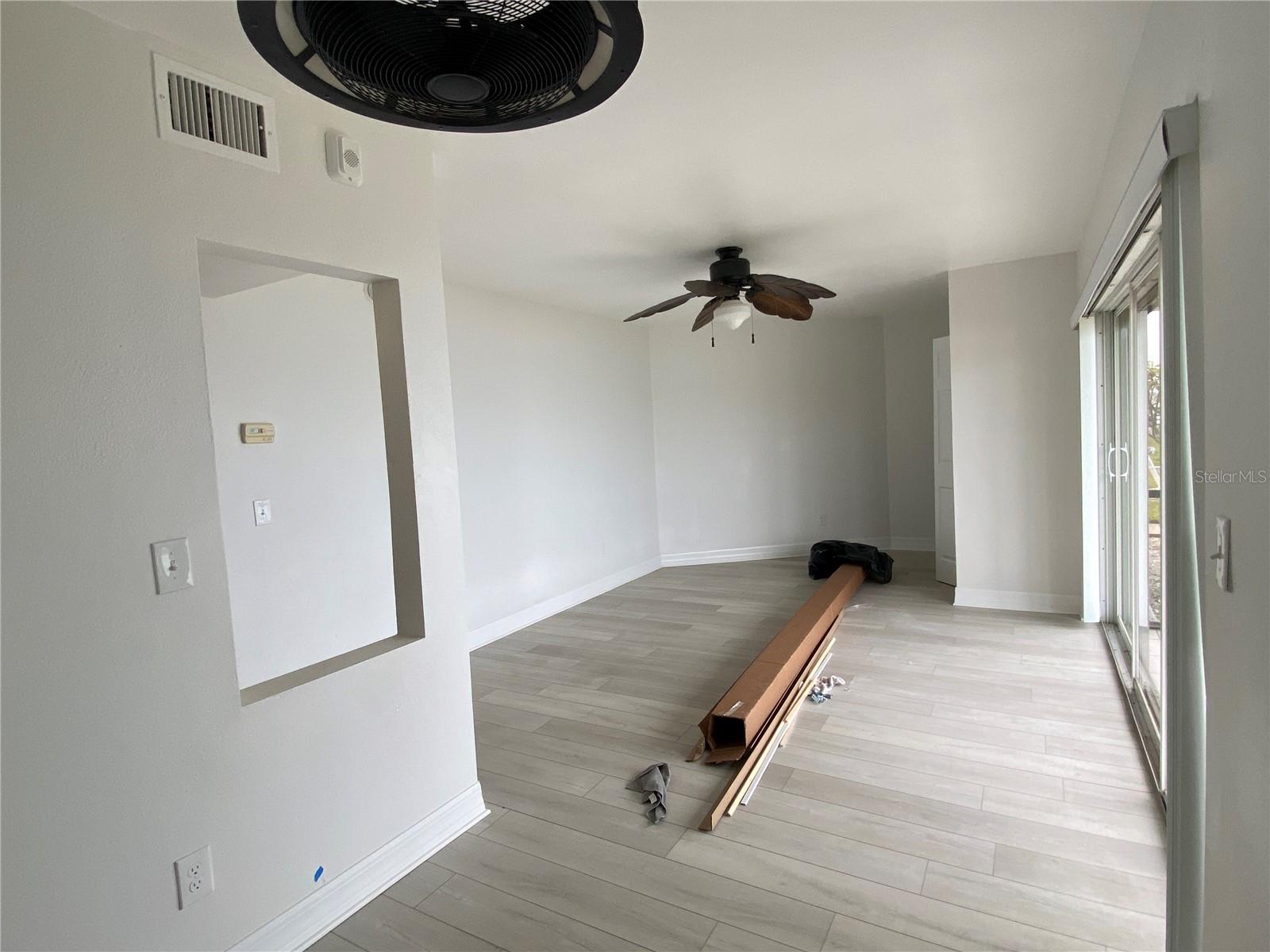 view from bed area towards south end of unit.(after remediation- box is for the blinds)