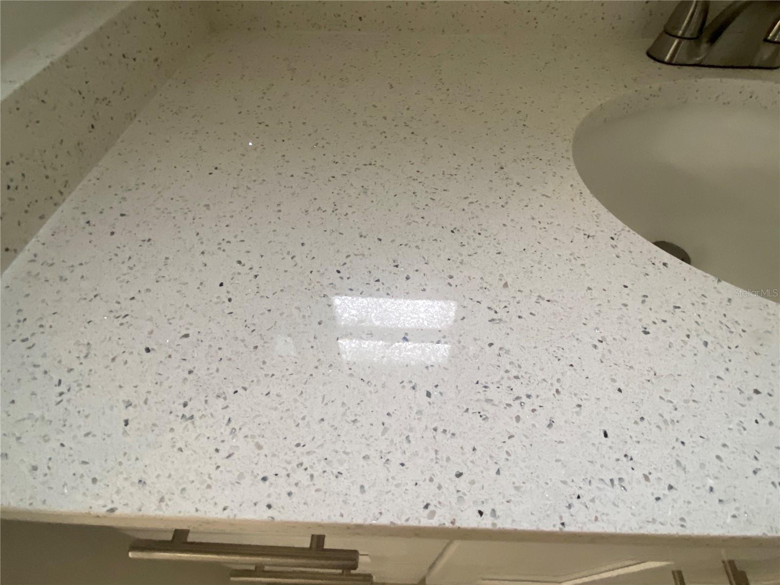 Quartz counter top ( in both kitchen & bath)