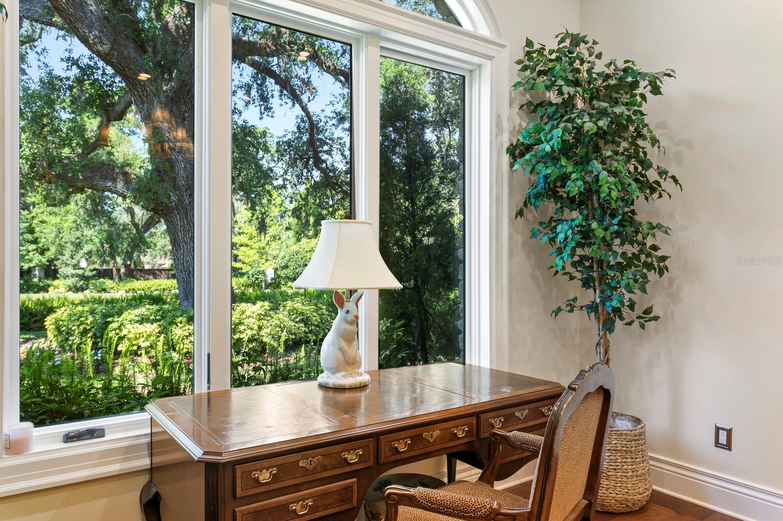 . Perfect for moments of quiet reflection or creativity, this space offers a picturesque view of lush greenery, making every glance a brief escape into nature's embrace.
