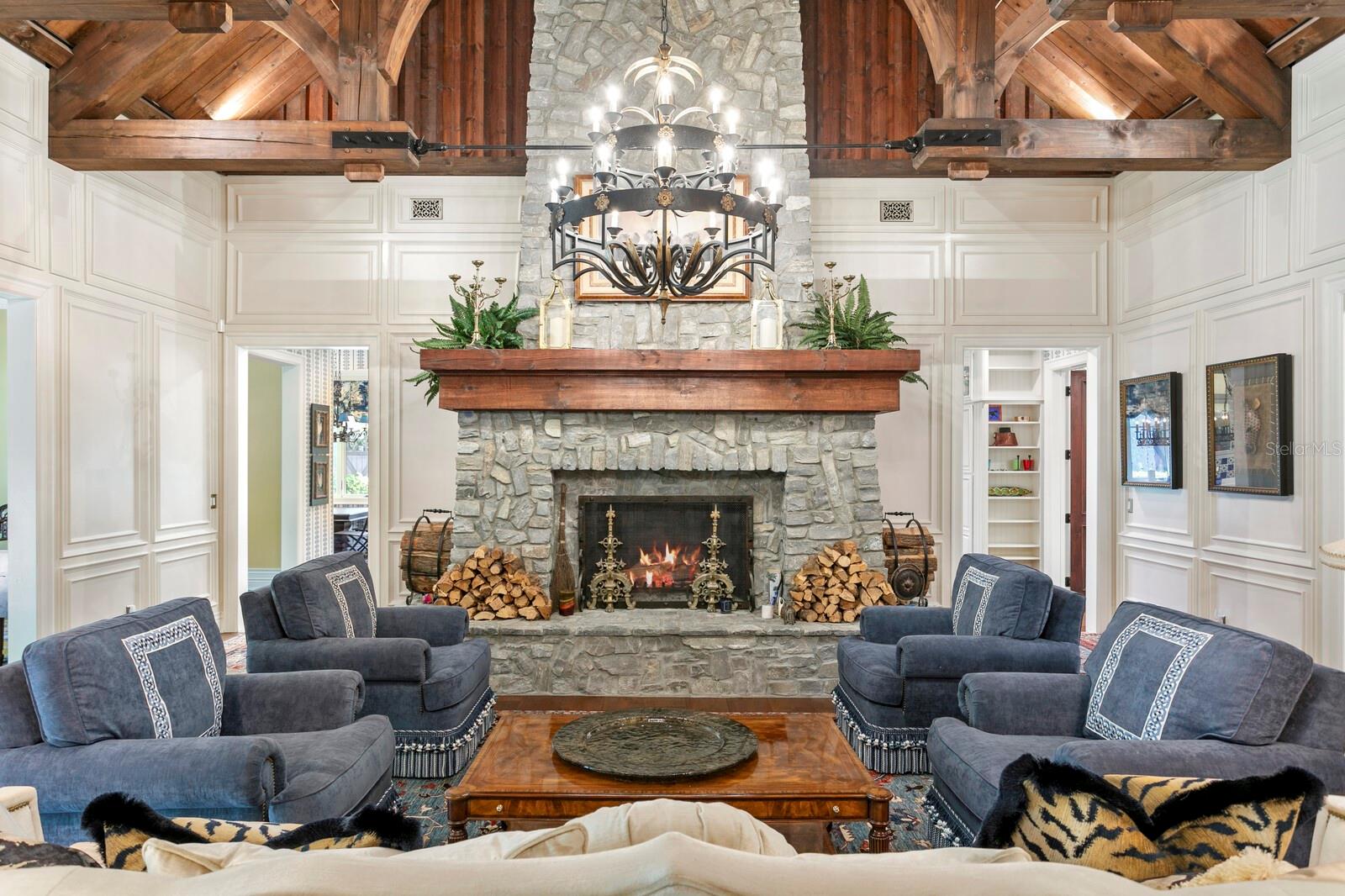 Step into a realm of rustic elegance where vaulted wooden ceilings and exposed beams command attention and inspire a cozy grandeur.
