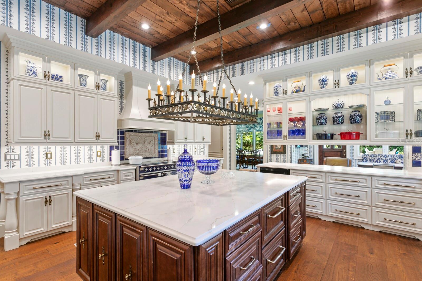 Natural light dances across the polished hardwood floor, creating a welcoming ambiance