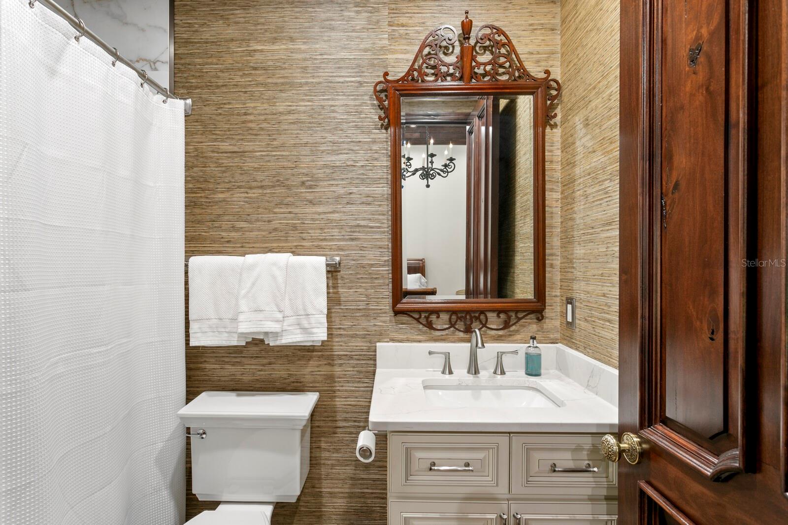 Step into a sanctuary where elegance meets functionality in this lavish bathroom.