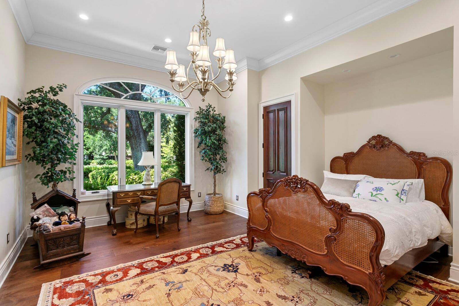 Nestled in the heart of a picturesque landscape, this enchanting bedroom invites you to revel in its blend of elegance and charm.