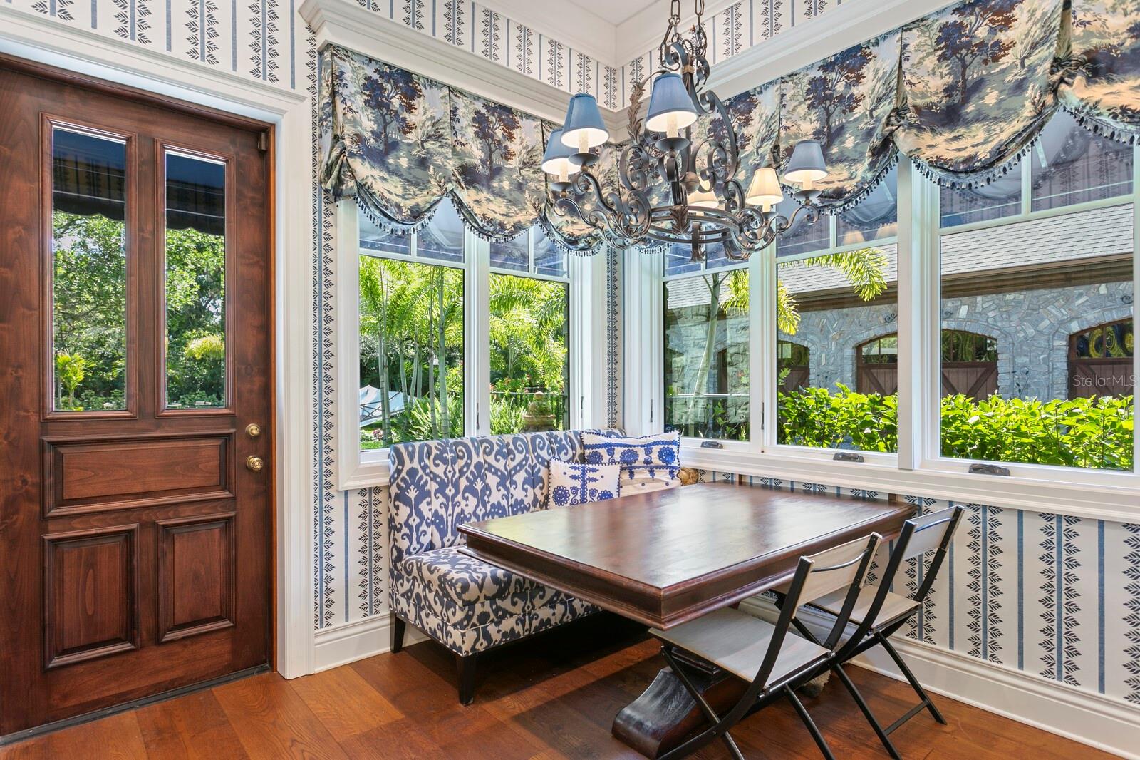 Step into this charming breakfast nook, where mornings come alive with views that rival a tropical escape.