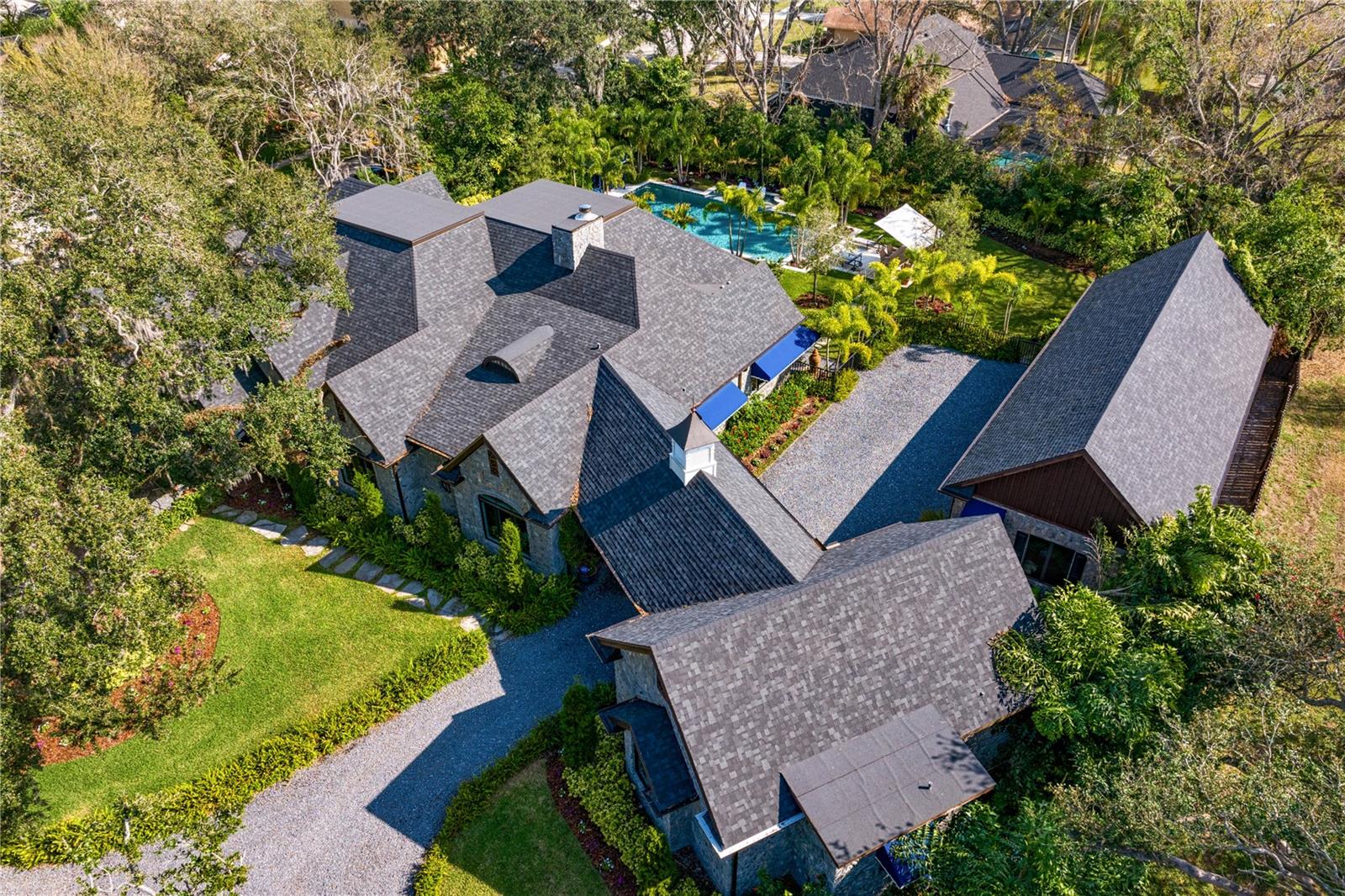 With its elegant rooflines and charming pathways, this residence promises both privacy and elegance.