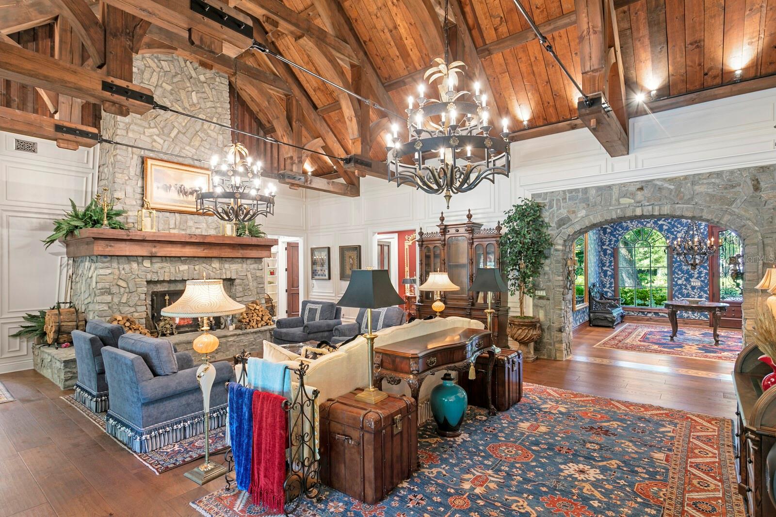 Whether it’s basking in the soft glow of the chandelier or warming up to the fire, this space is designed for cherished moments and undeniable comfort.