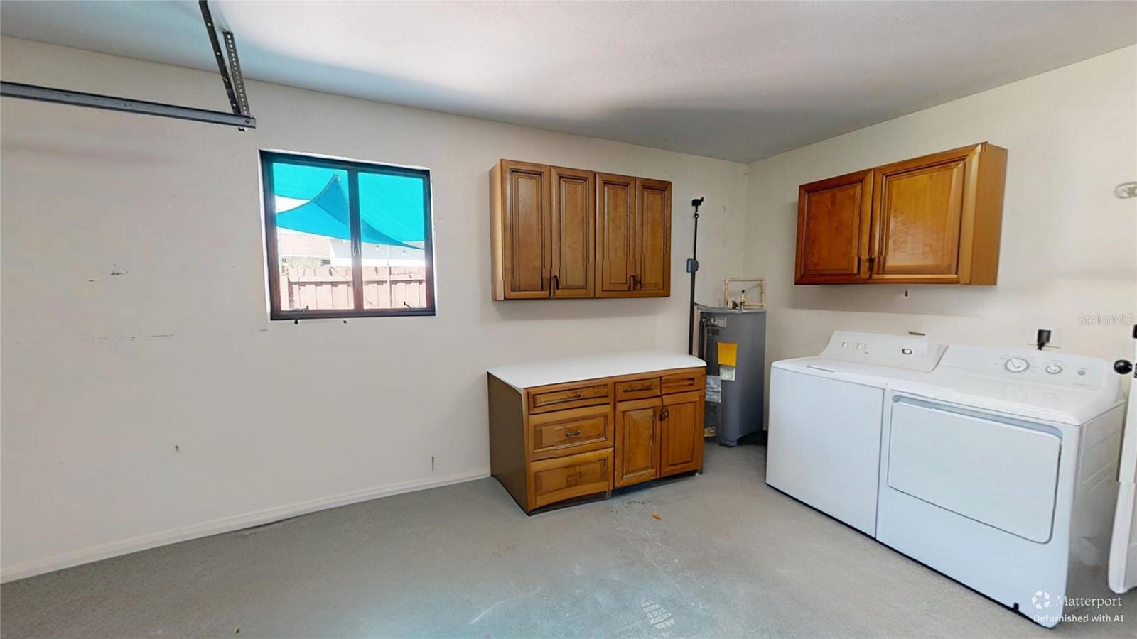 Laundry area in Garage - Virtually De-furnished
