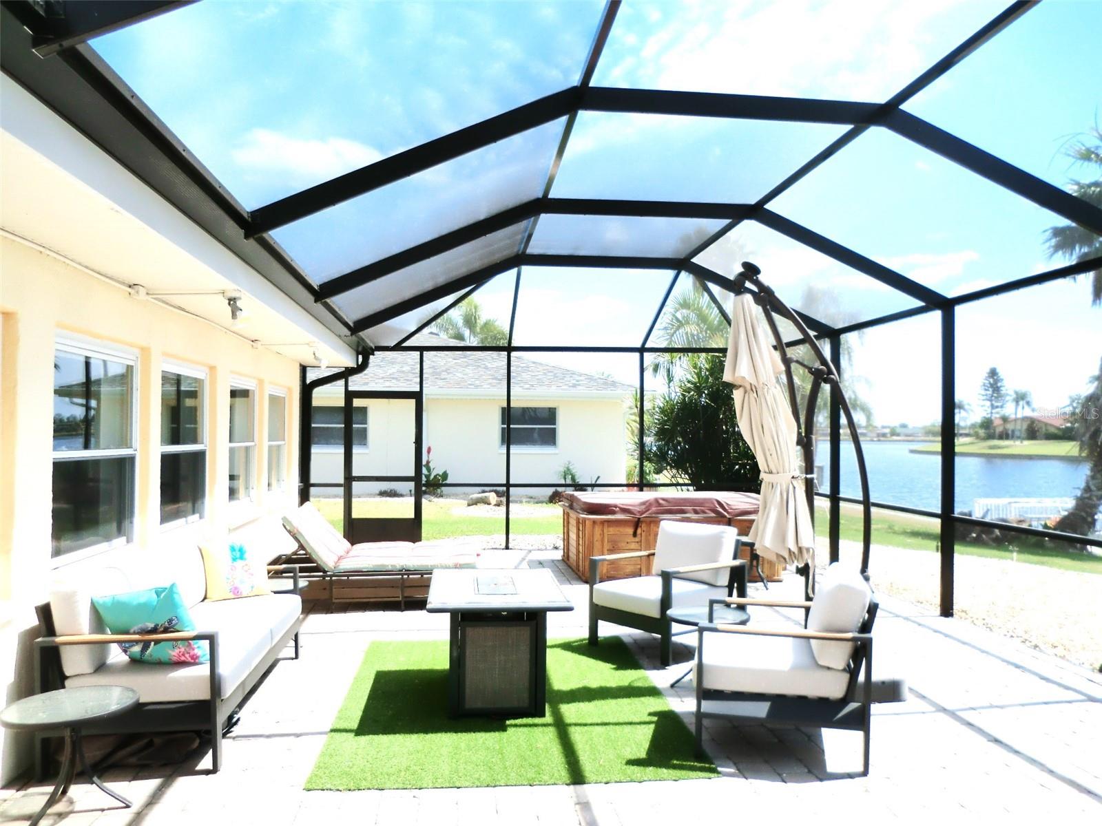 Large 20x53 brick paver lanai with new screen cage.  Looking East