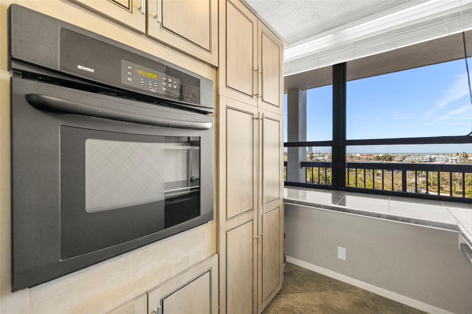 Built in oven with plenty of storage in the kitchen