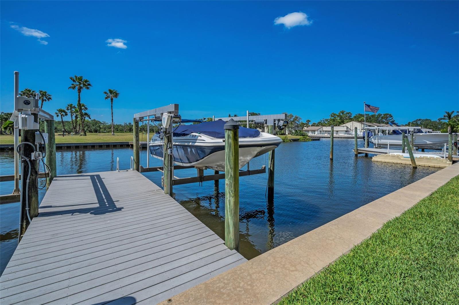 Dock is shared and maintenance is by HOA Lift/slip to right is owned by Seller and conveys at closing. Boat is not included in Sale of home