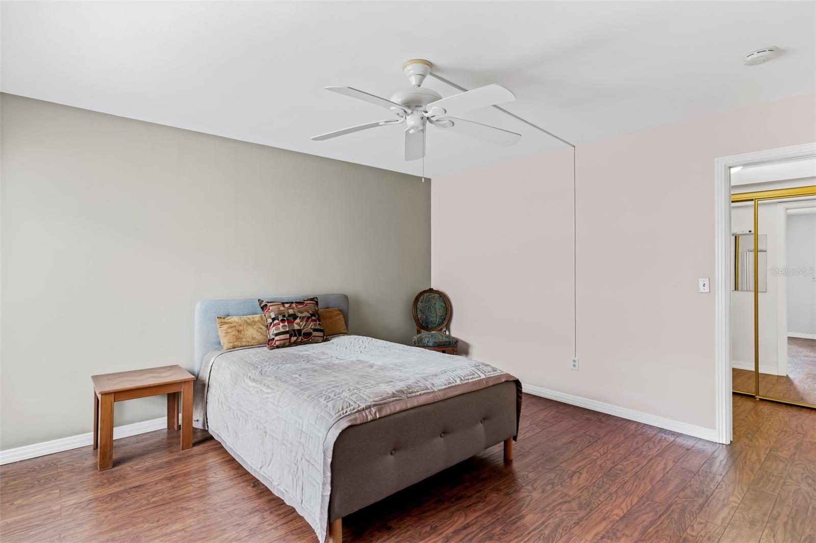 Primary bedroom with balcony access