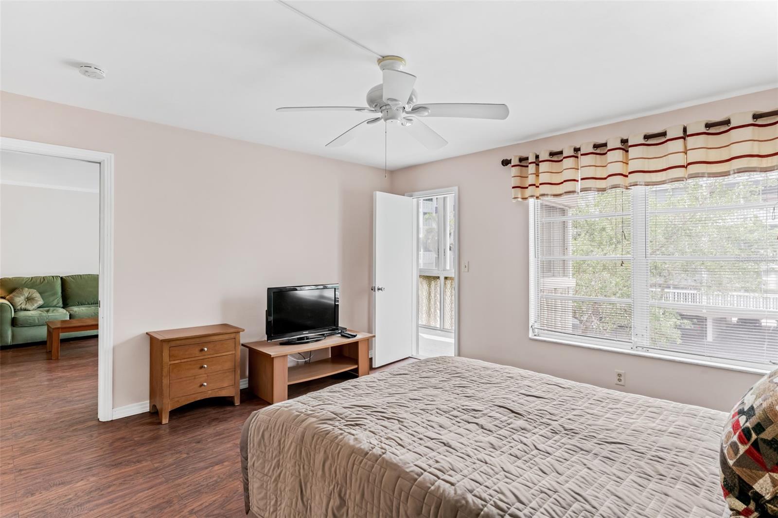 Primary bedroom with balcony access