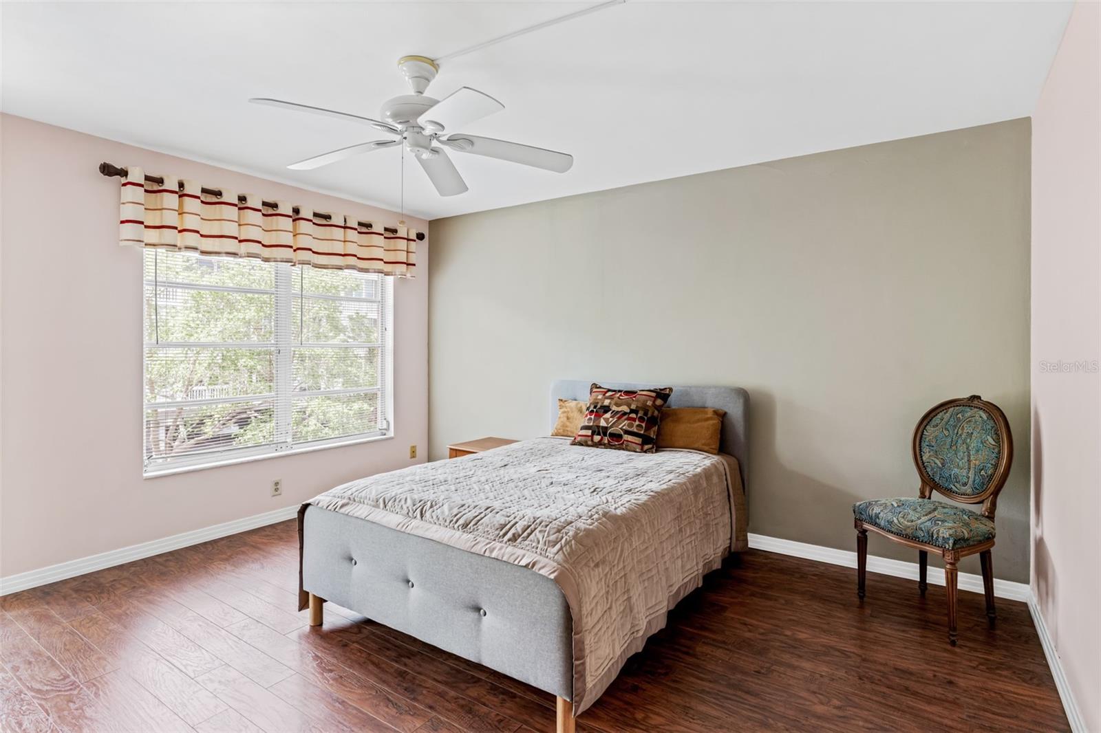Primary bedroom with balcony access