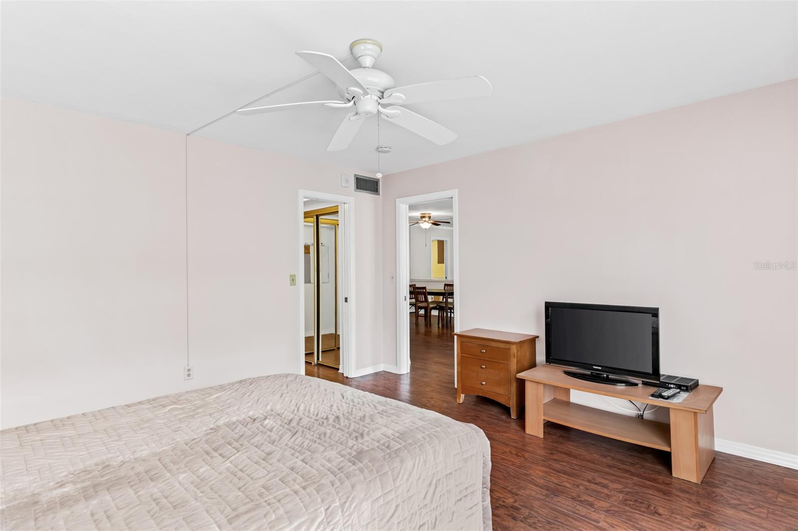 Primary bedroom with balcony access