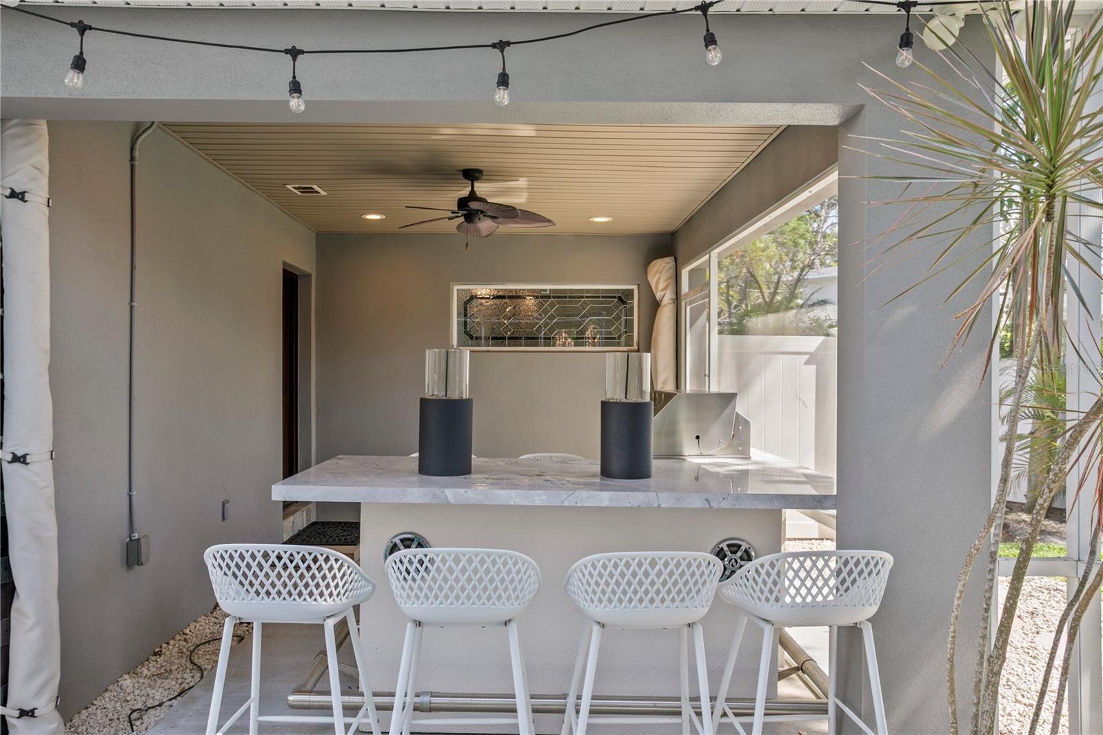 Screened in lanai grilling area.