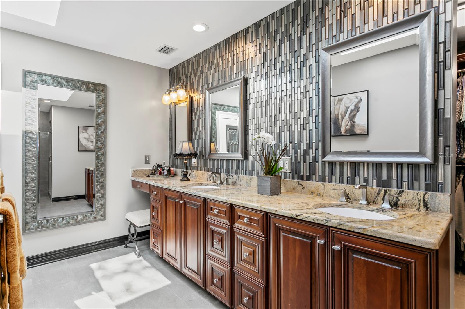 The Spa-like Primary Bathroom has dual vanities.