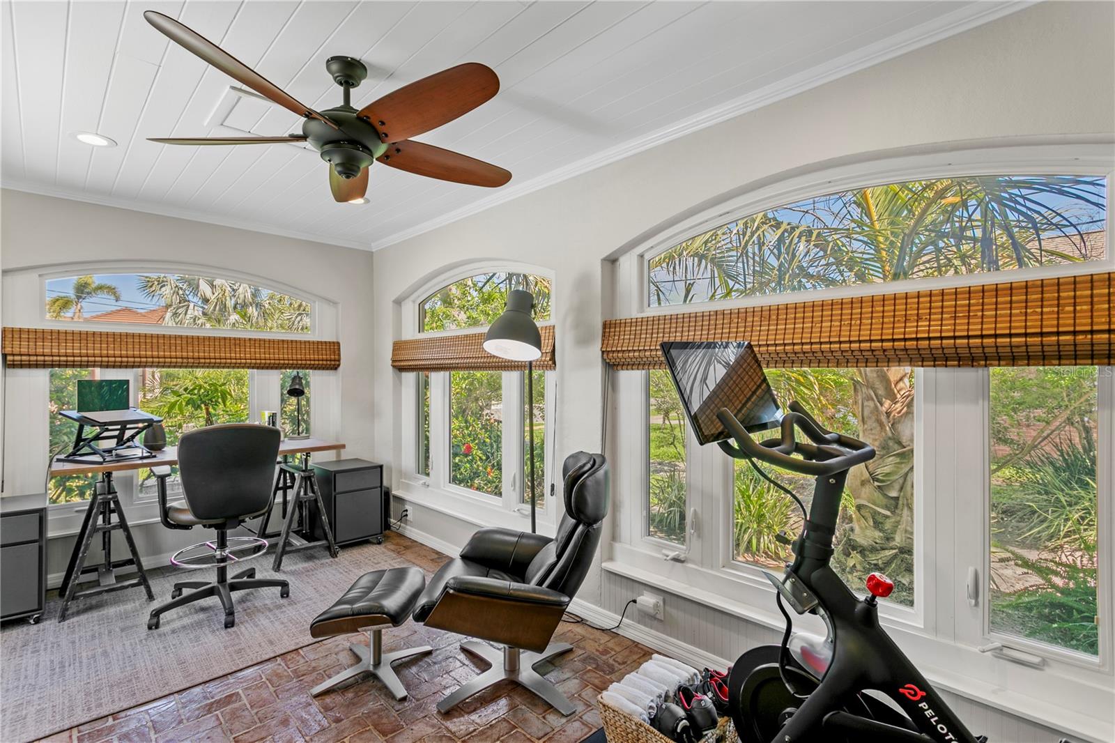Home Office with brick flooring.