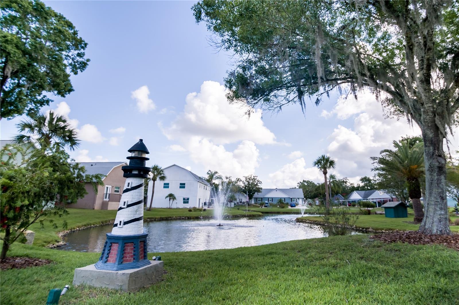 Peaceful pond view with lighthouse