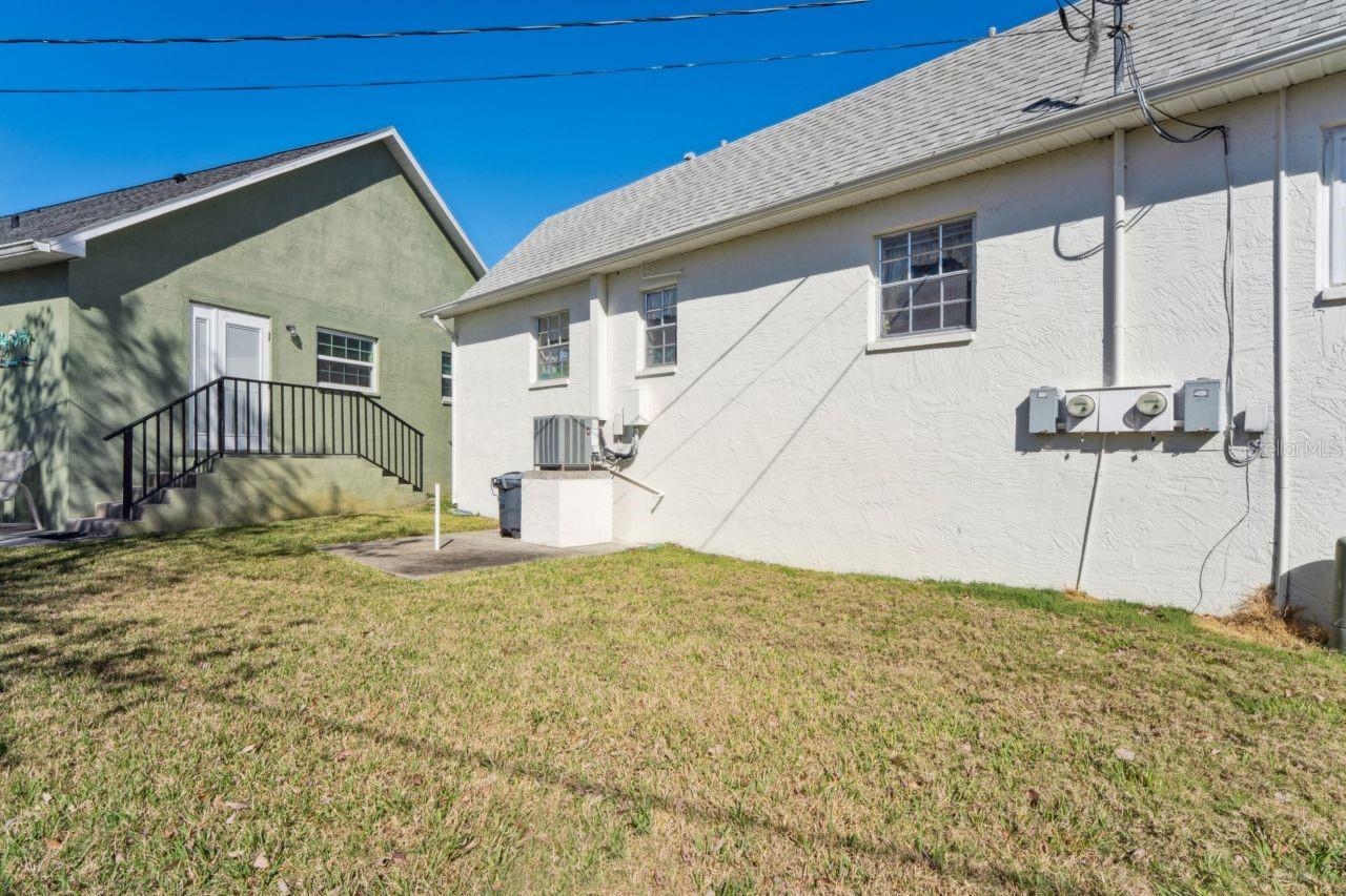 The view from the back, beneath the kitchen window and the guest bedroom window.