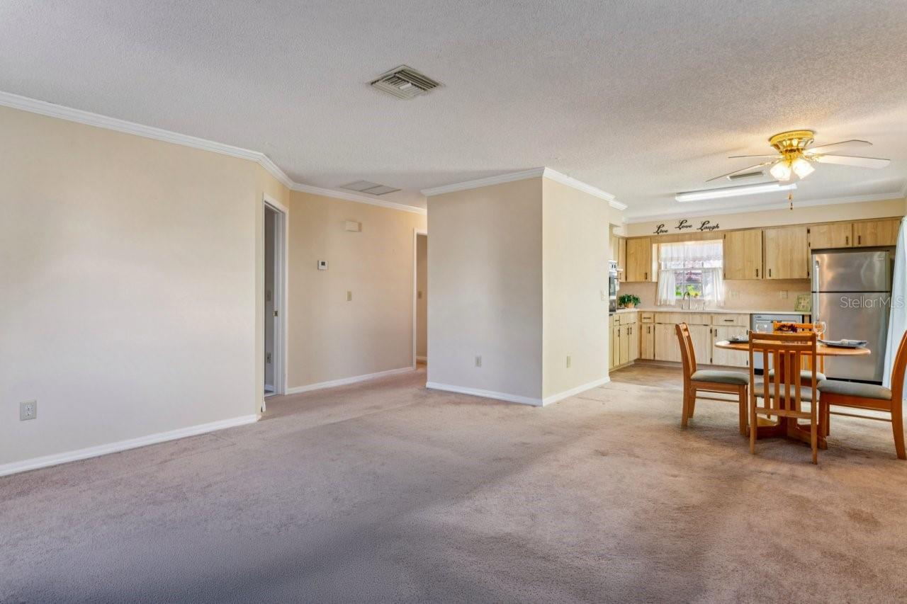 Interior view of the living room, dinette and kitchen area.
