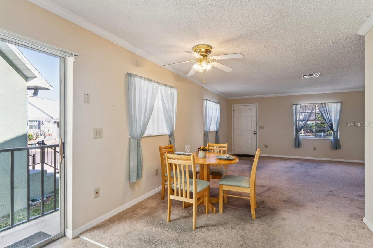 View from the kitchen, with a sliding door leading to the stairs that take you to the side and backyard.