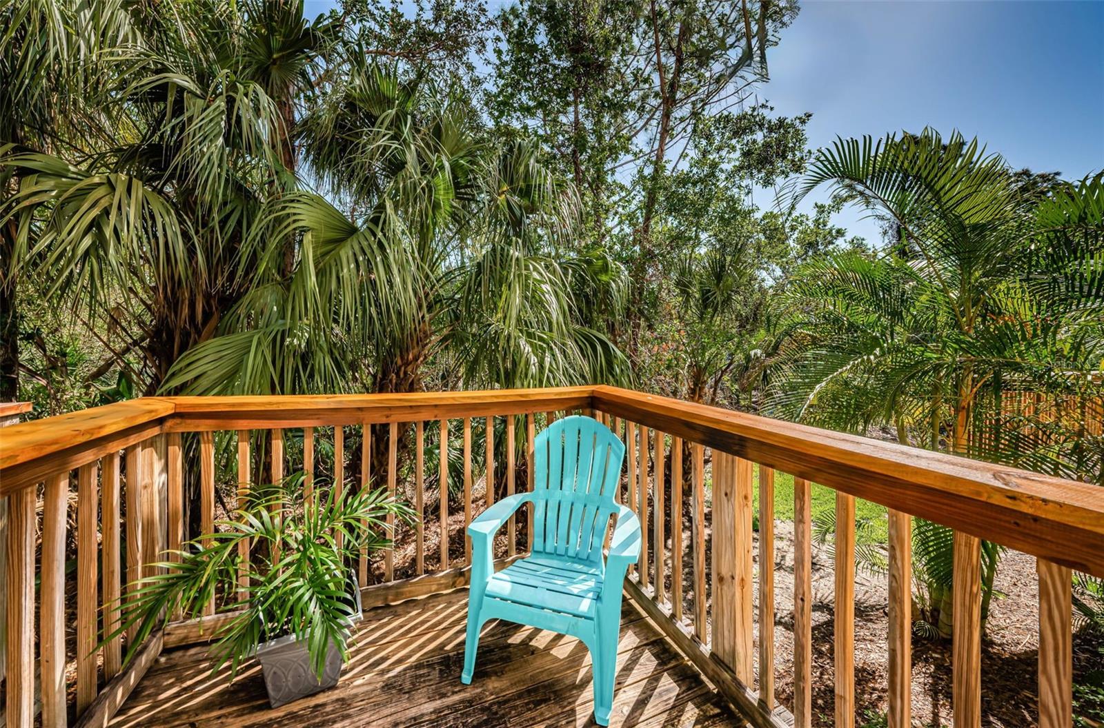 Wood balcony/deck off of first level bedroom