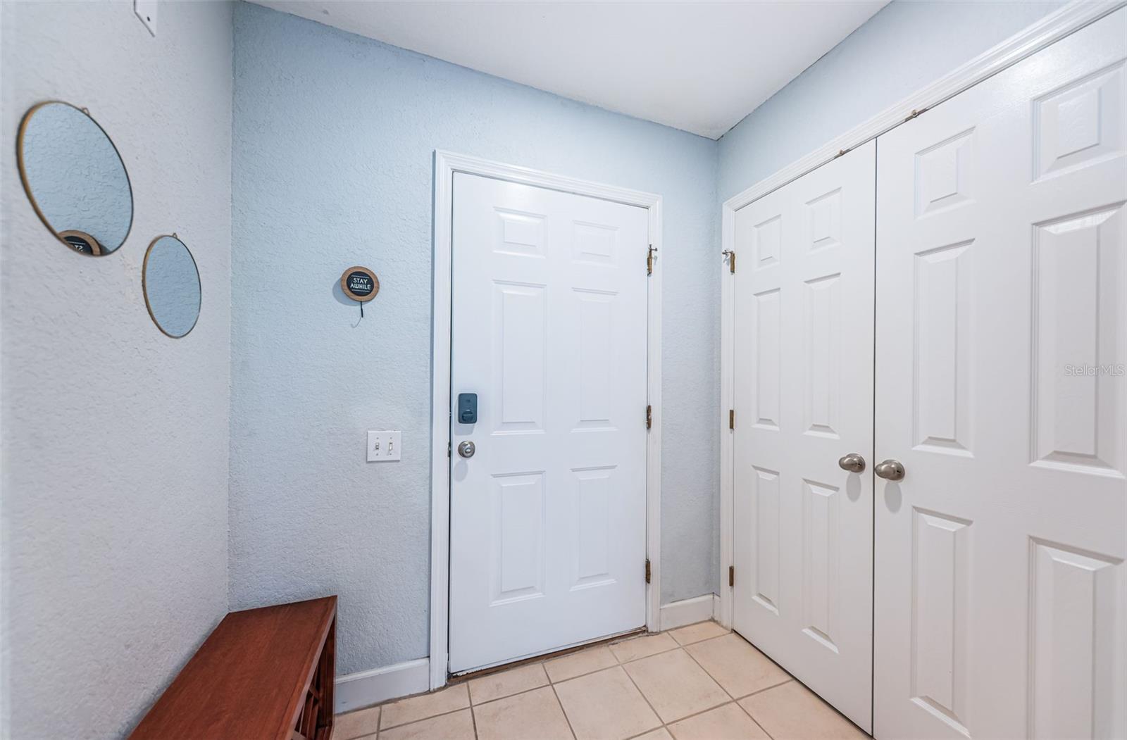 Front door with storage closet