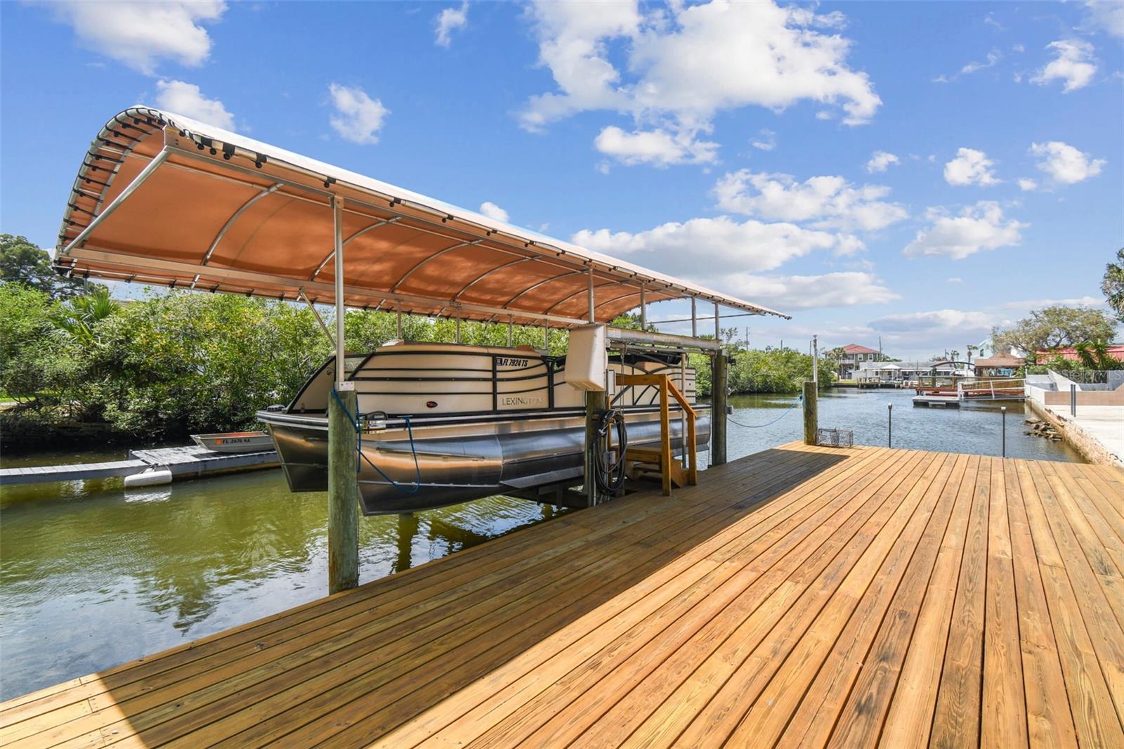 Boat lift, dock and canal that leads you straight to the Gulf of Mexico