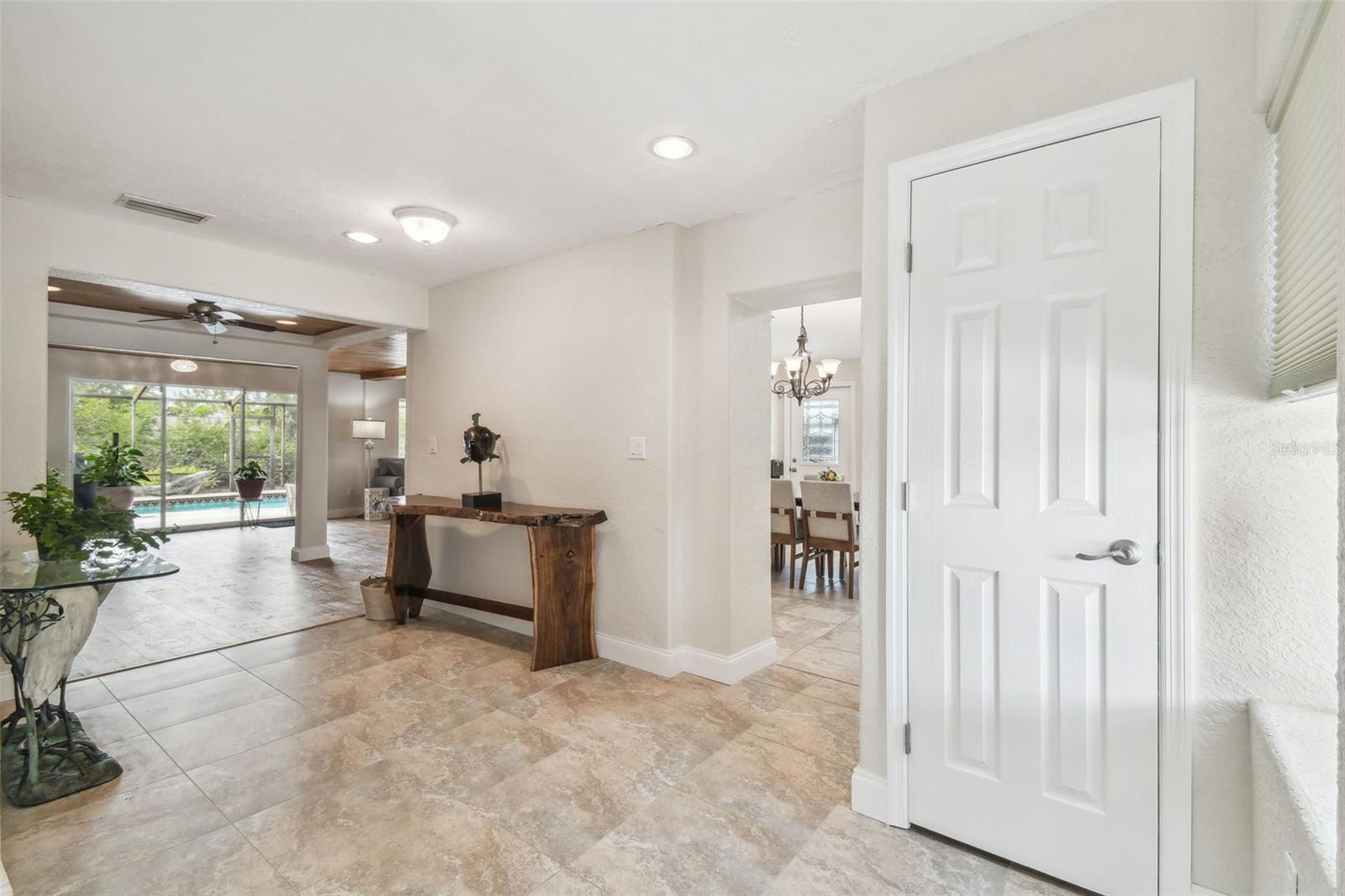 Entry of home leading to kitchen and family room