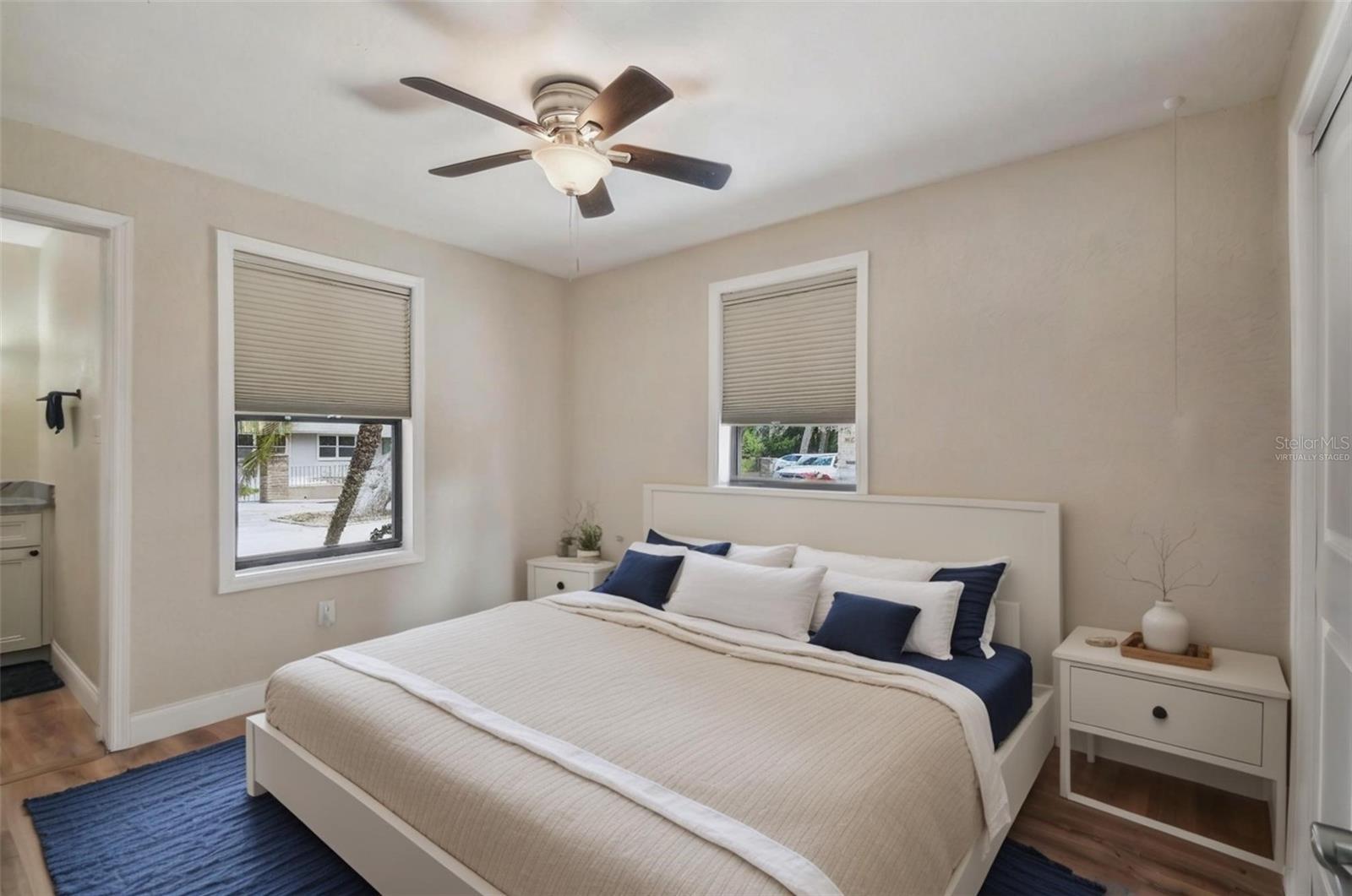 Primary bedroom with en suite bath virtually staged