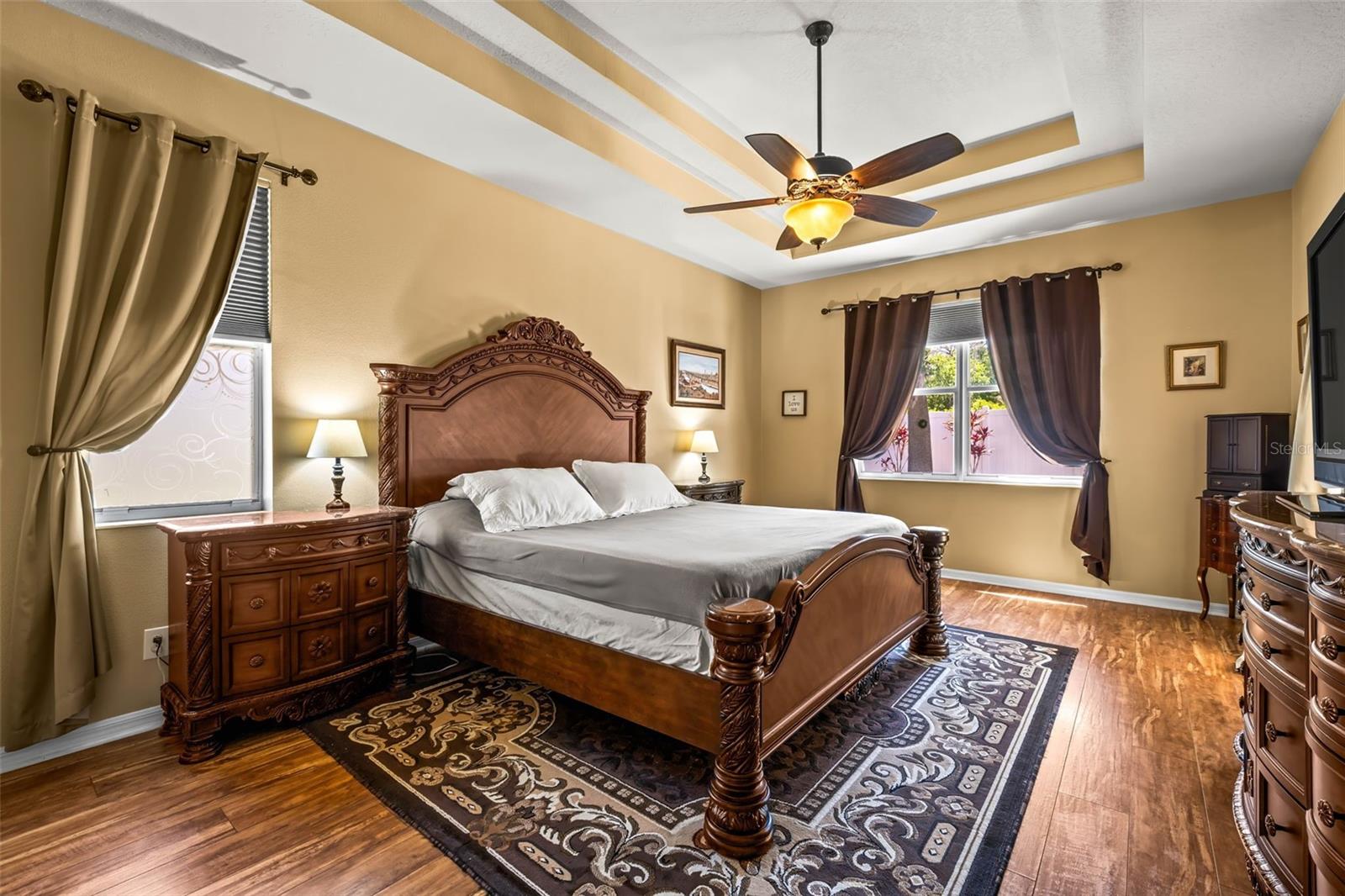 Spacious Primary Bedroom with coffered ceilings