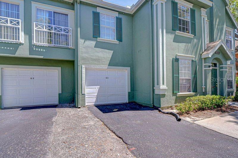 Deed Garage attached to building 16 with parking space in front of it