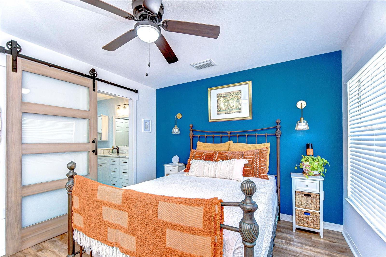 Primary bedroom with ensuite bathoom with Barn door entrance
