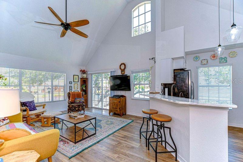 Your new living room has views of lake from the windows and vaulted ceiling.