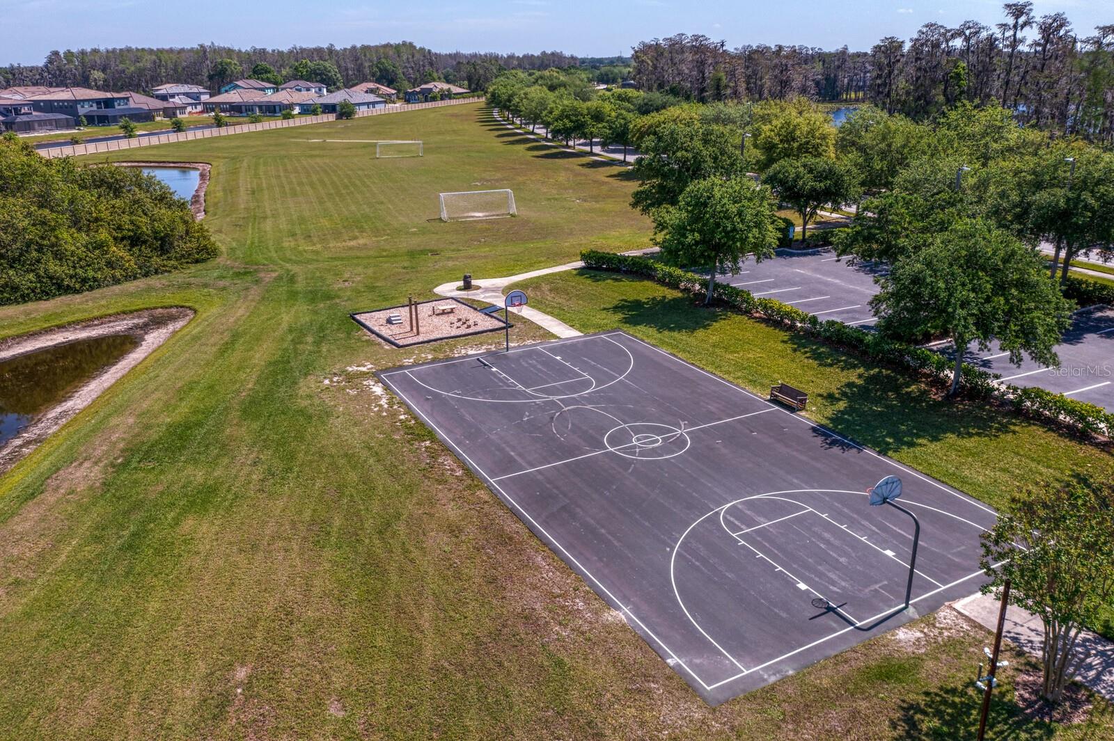 Community basketball court, outdoor gym and cricket pitch field
