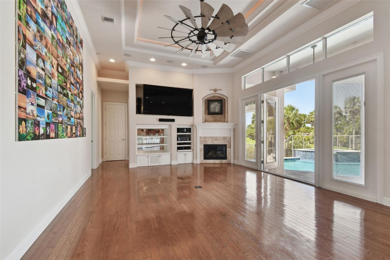 Family room overlooking the swimming pool and golf course.