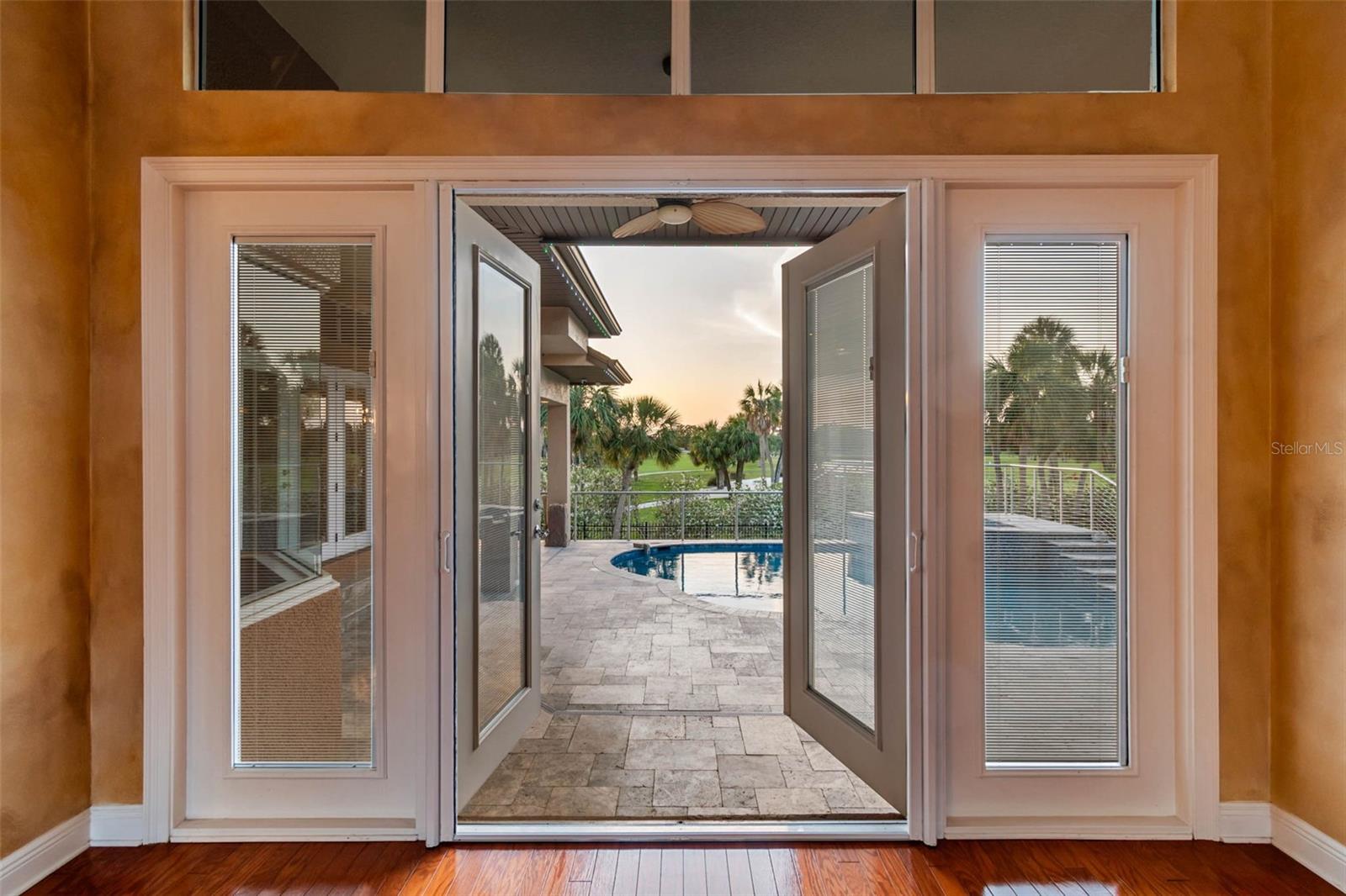 French doors from living room to Pool area.