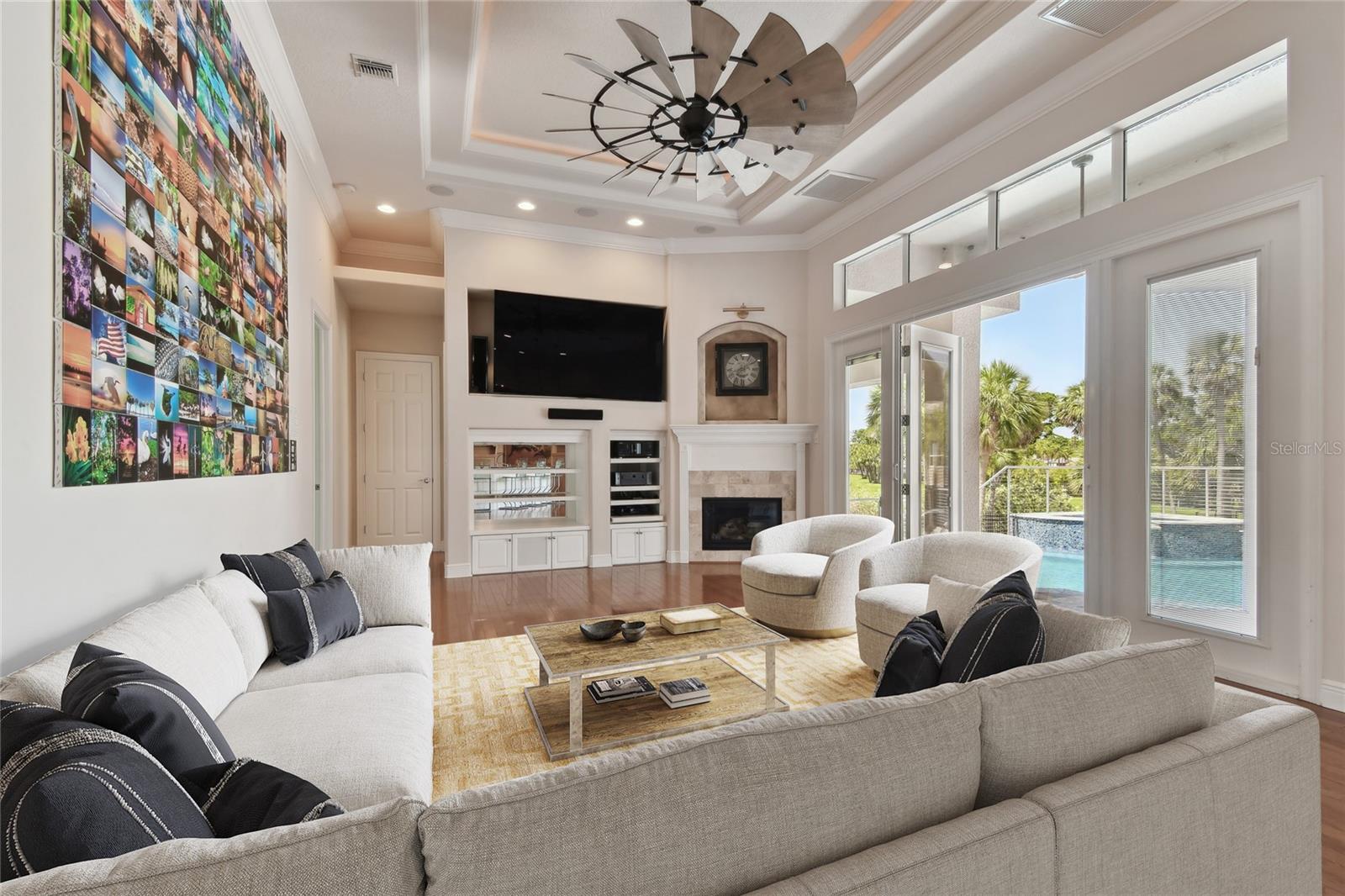Staged Family overlooking the swimming pool and golf course.