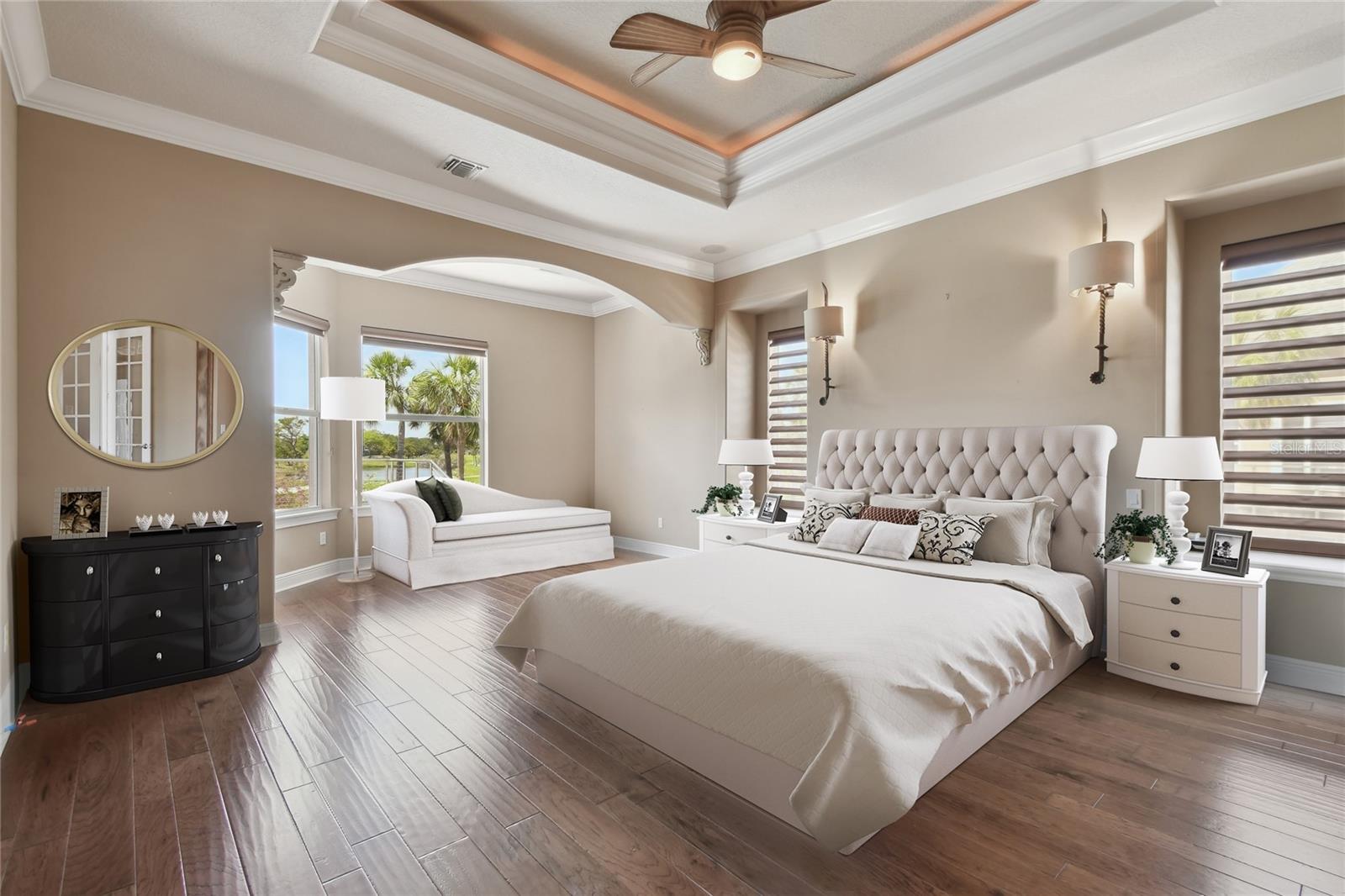 Staged View of primary bedroom.