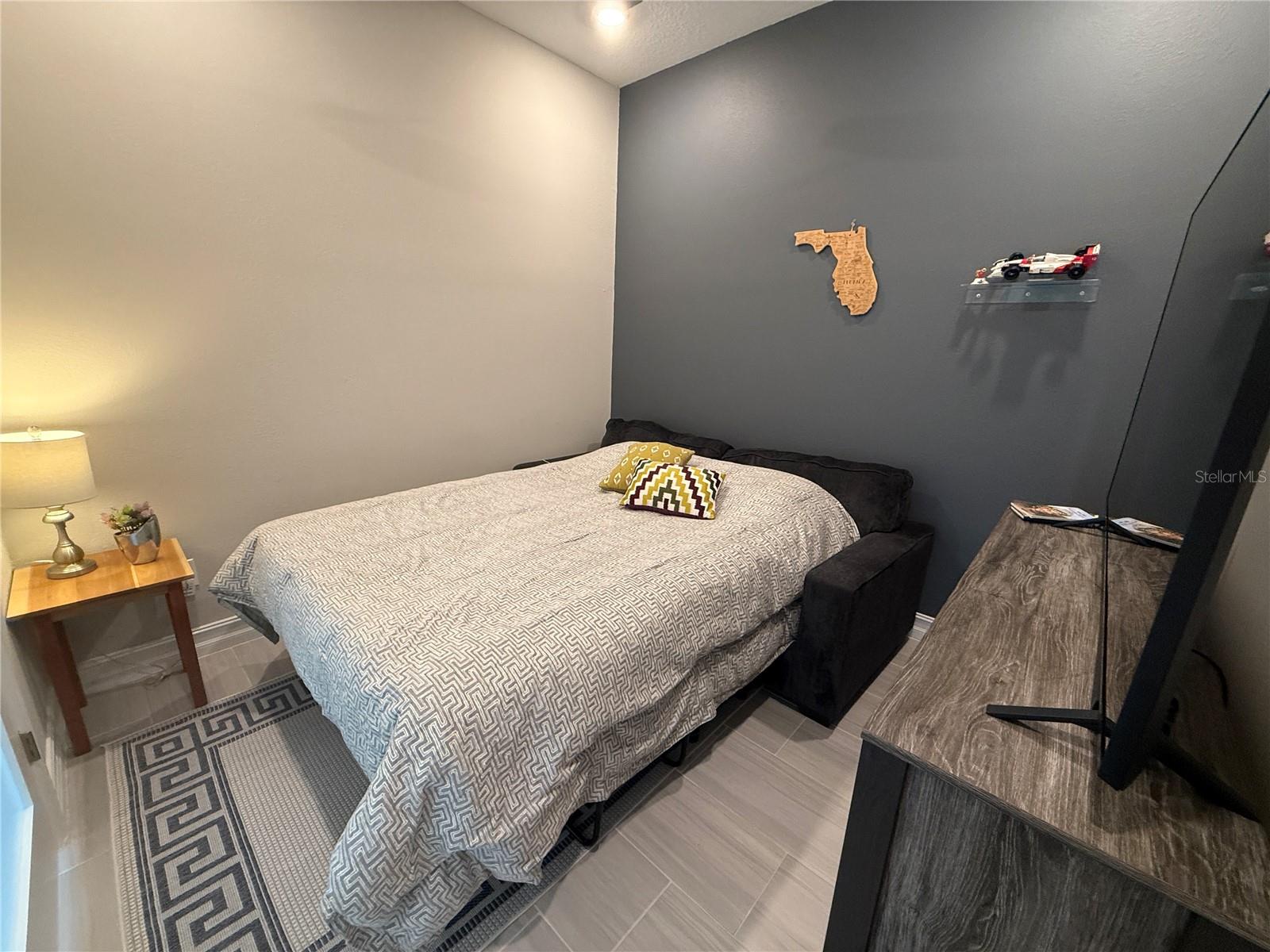Den, when in use as a bedroom