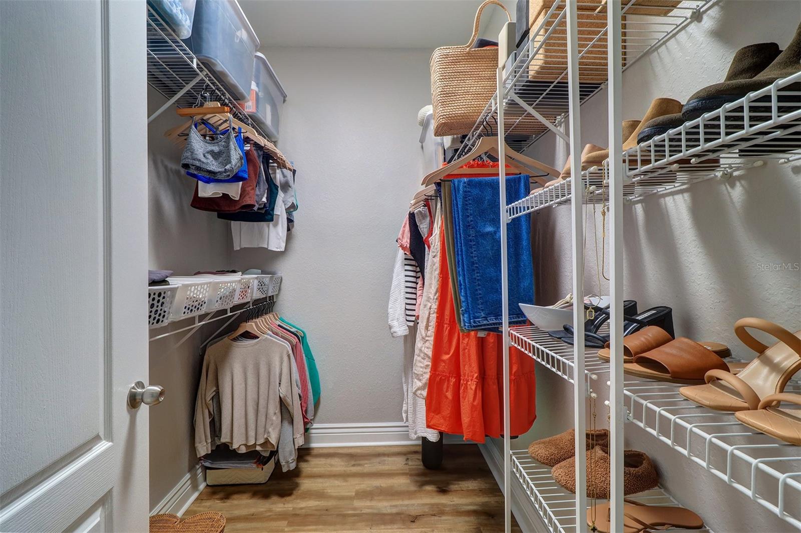 Walk in closet in primary bedroom