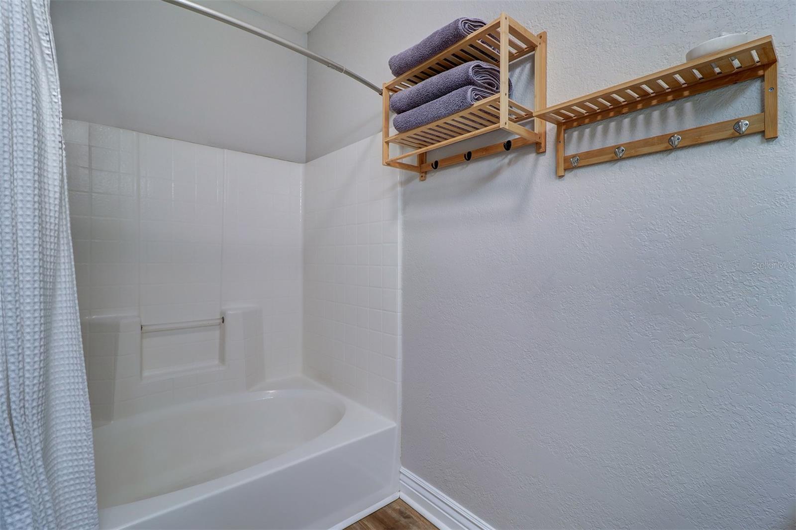 Primary bathroom with tub shower combination